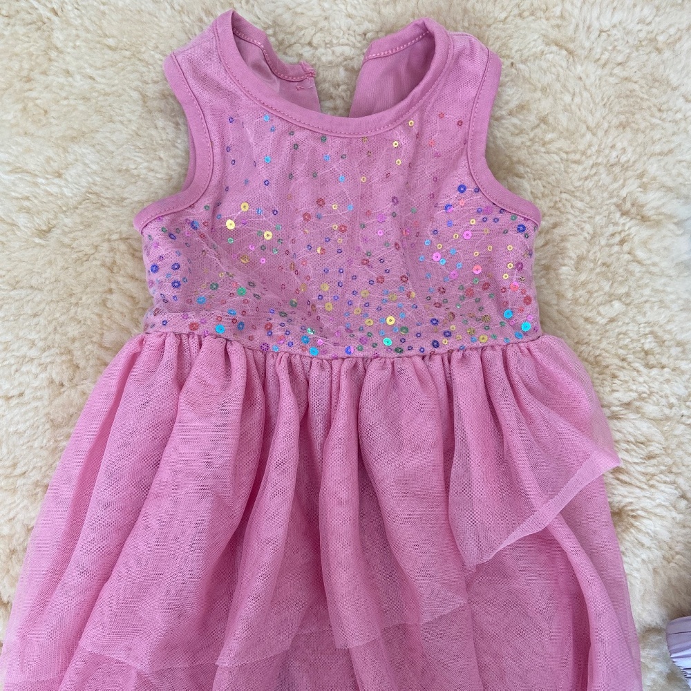Light and stunning pink and rainbow sequin dress 🥹